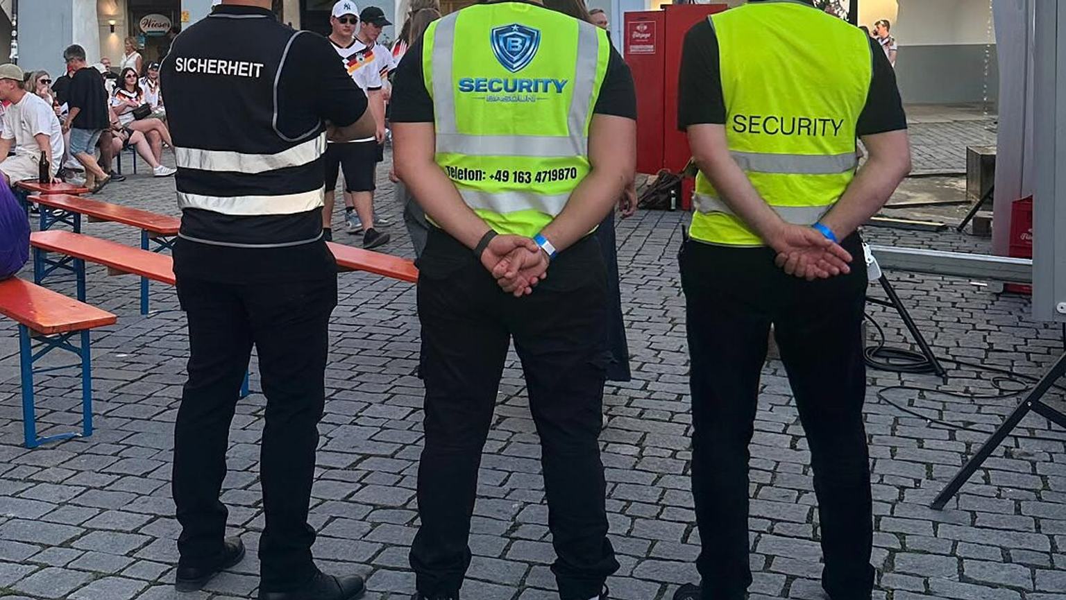 High-visibility vests with the Basoun Security logo and the word Security